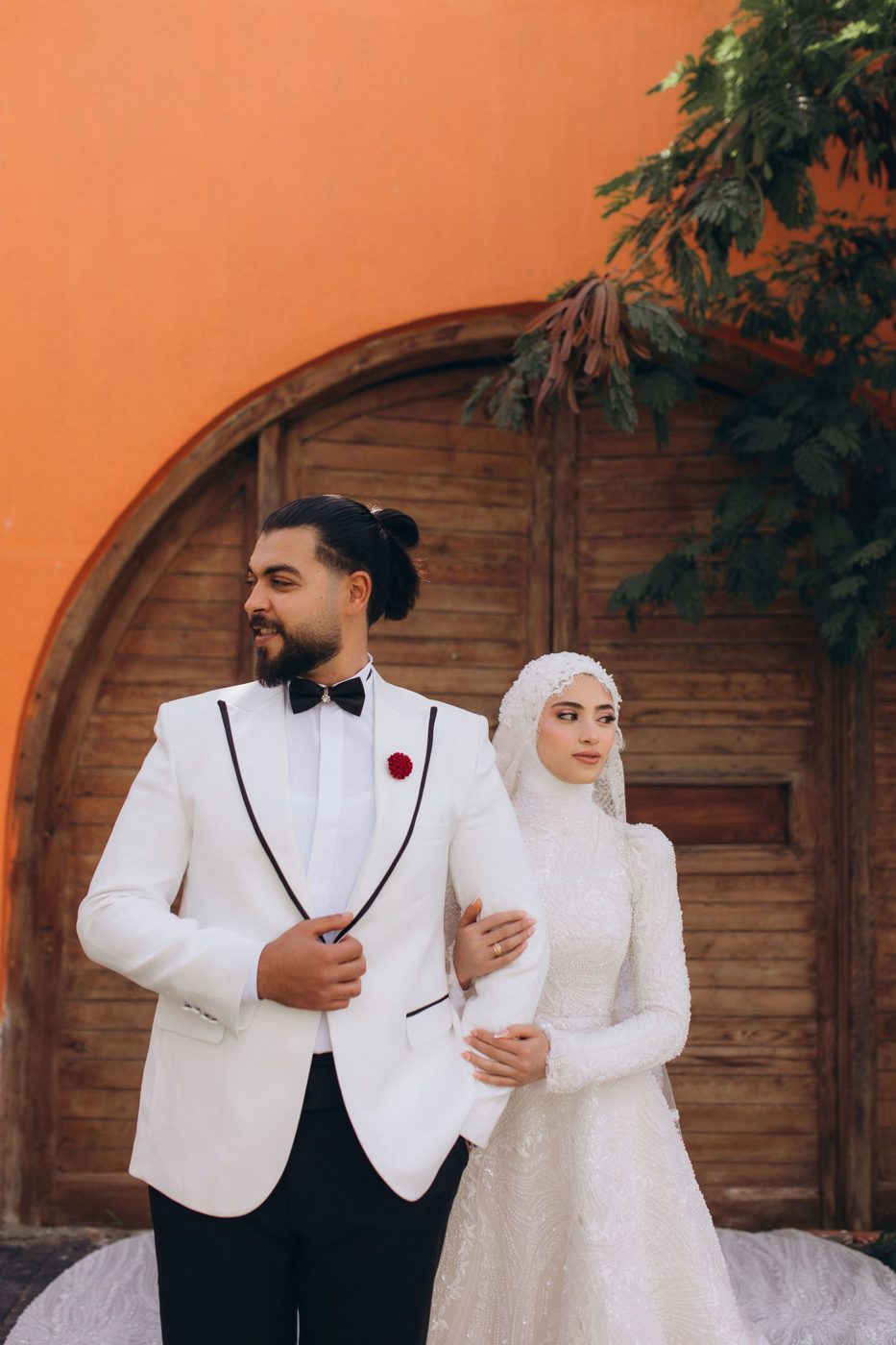 Muslim bride in hijab with her groom on their wedding day