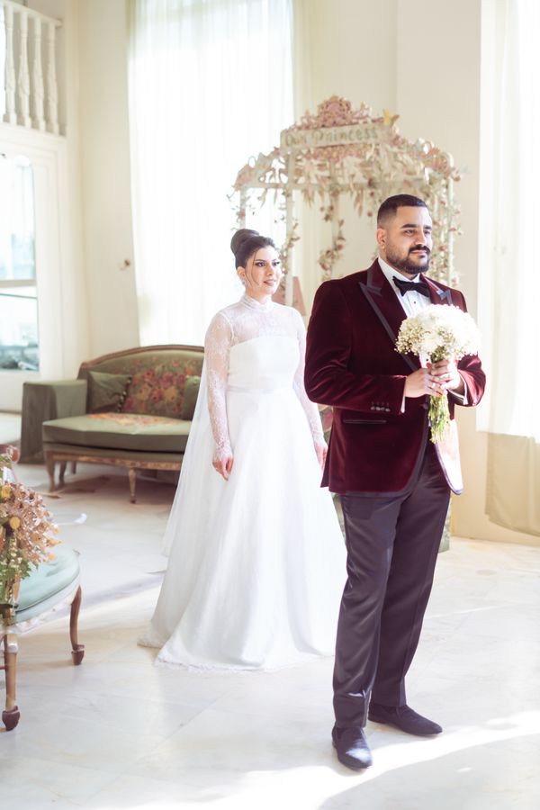 Iraqi bride and groom in a sunlit room